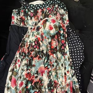 Handmade sundress multi layer and color. Fits well but needs a slip underneath.